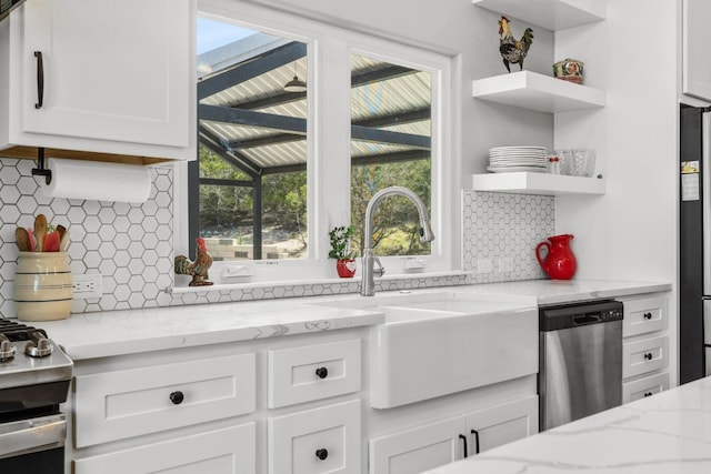 631 Lakeside Dr, Wimberley, TX 78676 - kitchen featuring a wealth of natural light, appliances with stainless steel finishes, open shelves, and a sink