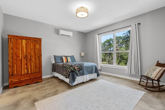 631 Lakeside Dr, Wimberley, TX 78676 - bedroom featuring a wall mounted air conditioner and baseboards