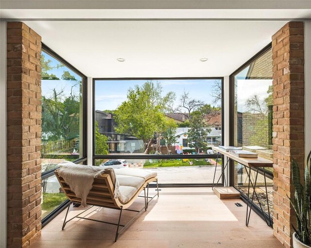 2012 Arpdale St, Austin, TX 78704 - sunroom featuring expansive windows and wood finished floors