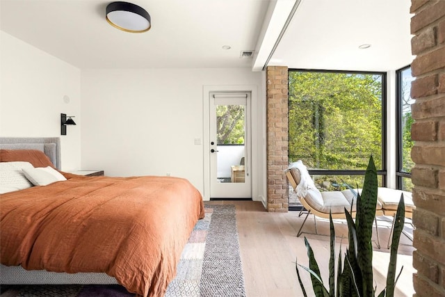 2012 Arpdale St, Austin, TX 78704 - bedroom with wood finished floors and access to exterior