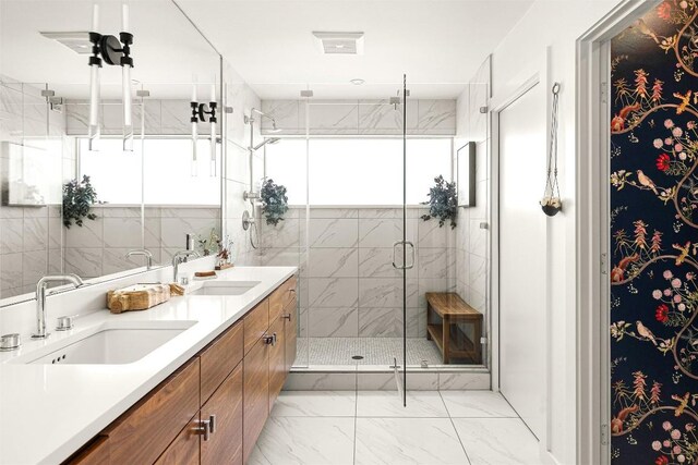 2012 Arpdale St, Austin, TX 78704 - full bathroom featuring double vanity, a shower stall, and marble look tiles