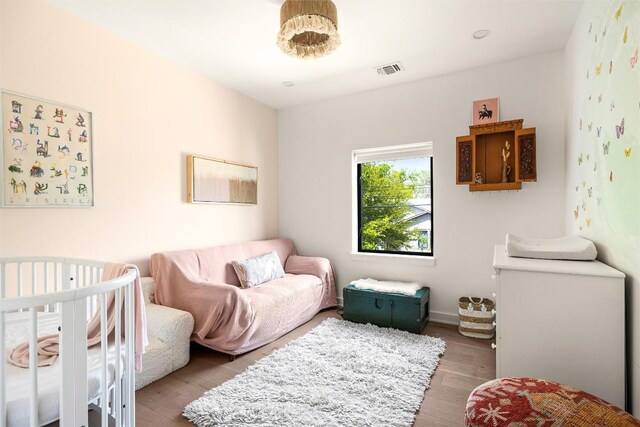 2012 Arpdale St, Austin, TX 78704 - bedroom featuring wood finished floors and baseboards