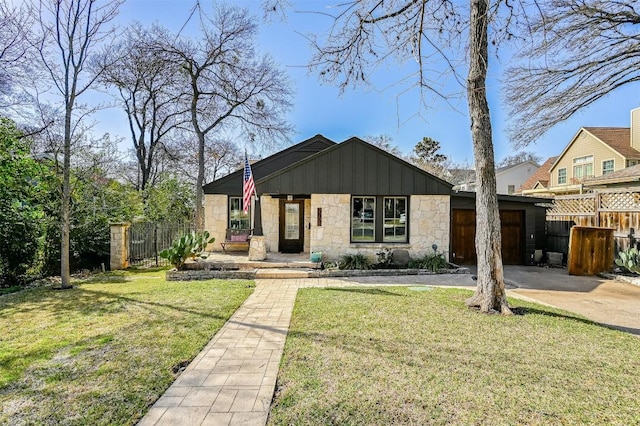 2208 Mountain View Rd, Austin, TX 78703 - view of front of home featuring an attached garage, stone siding, and driveway