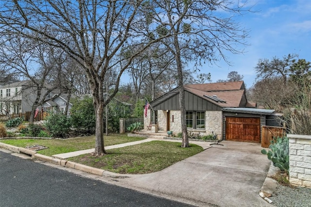 2208 Mountain View Rd, Austin, TX 78703 - mid-century home with stone siding, concrete driveway, board and batten siding, and an attached garage