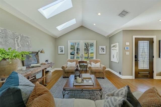 2208 Mountain View Rd, Austin, TX 78703 - living area featuring crown molding, a skylight, vaulted ceiling, wood finished floors, and baseboards