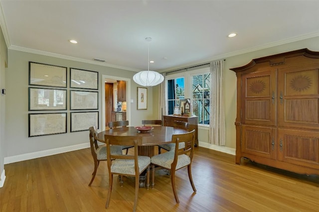 2208 Mountain View Rd, Austin, TX 78703 - dining space with baseboards, light wood-style floors, ornamental molding, and recessed lighting