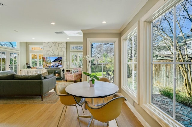 2208 Mountain View Rd, Austin, TX 78703 - sunroom / solarium with wood finished floors, plenty of natural light, ornamental molding, and recessed lighting