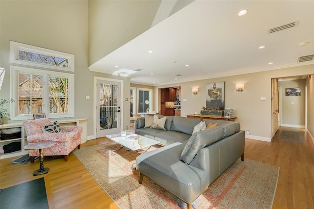 2208 Mountain View Rd, Austin, TX 78703 - living room featuring crown molding, wood finished floors, recessed lighting, and baseboards