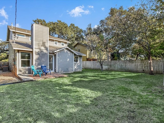 10310 Bilbrook Pl, Austin, TX 78748 - rear view of property with a fenced backyard, a chimney, and a patio