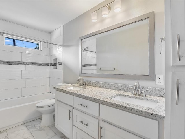 10310 Bilbrook Pl, Austin, TX 78748 - bathroom with double vanity, shower / tub combination, and marble look tile flooring