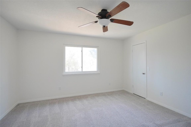 8521 Racine Trl, Austin, TX 78717 - empty room featuring light carpet, ceiling fan, and baseboards