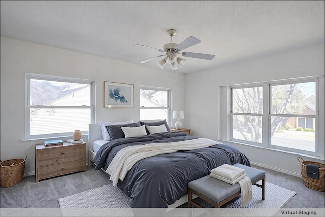 8521 Racine Trl, Austin, TX 78717 - bedroom featuring light carpet, multiple windows, baseboards, and ceiling fan