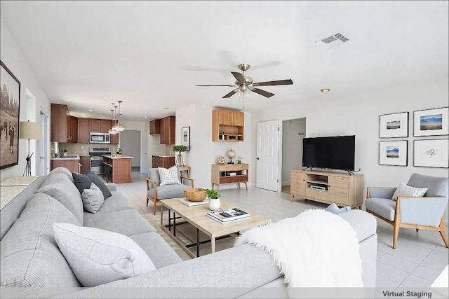 8521 Racine Trl, Austin, TX 78717 - living area featuring ceiling fan, recessed lighting, and light tile patterned flooring