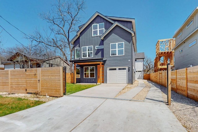 4800 Prock Ln Unit A, Austin, TX 78721 - contemporary home with board and batten siding, driveway, and an attached garage