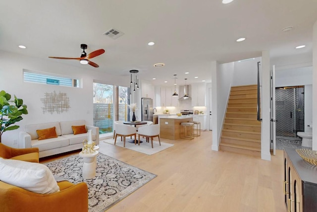 4800 Prock Ln Unit A, Austin, TX 78721 - living area featuring light wood-type flooring, stairway, a ceiling fan, and recessed lighting