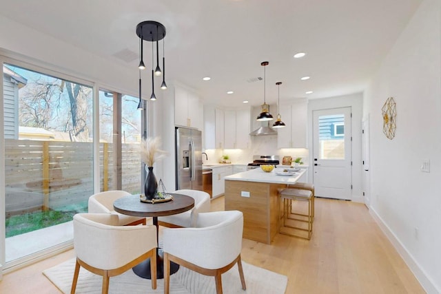 4800 Prock Ln Unit A, Austin, TX 78721 - dining area with light wood-style flooring, baseboards, and recessed lighting