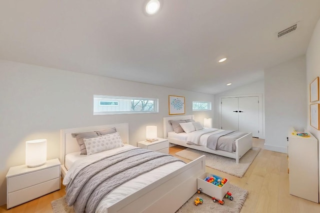4800 Prock Ln Unit A, Austin, TX 78721 - bedroom featuring light wood-style floors, lofted ceiling, recessed lighting, and a closet
