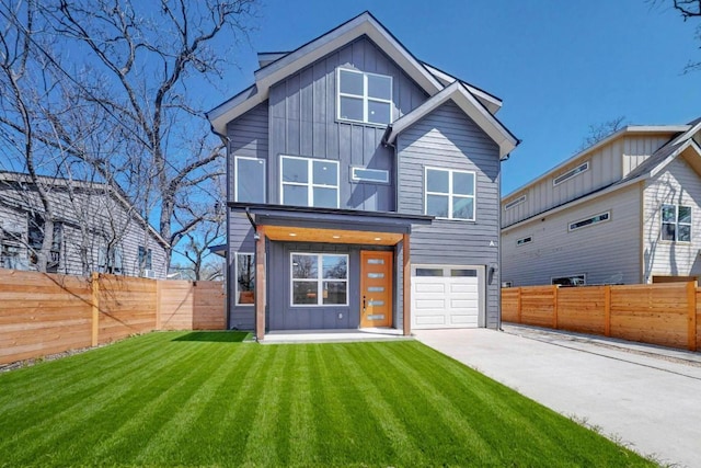 4800 Prock Ln Unit A, Austin, TX 78721 - contemporary home with board and batten siding, a garage, and driveway