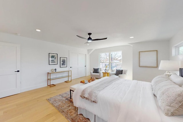 4800 Prock Ln Unit A, Austin, TX 78721 - bedroom with multiple windows, light wood-style flooring, recessed lighting, a ceiling fan, and baseboards
