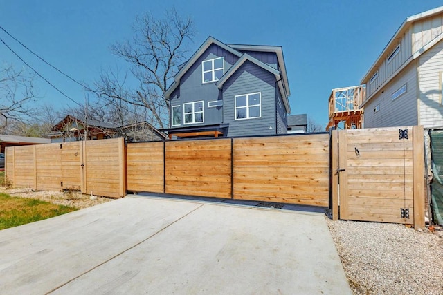 4800 Prock Ln Unit A, Austin, TX 78721 - view of front facade featuring a gate and board and batten siding