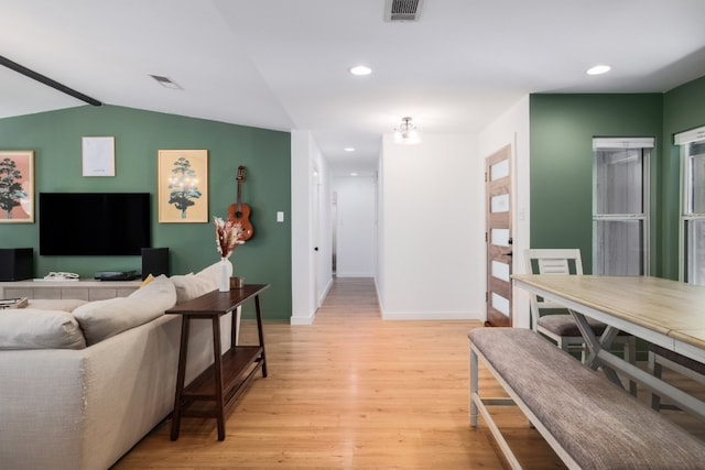 2205 Trede Dr, Austin, TX 78745 - living area featuring light wood finished floors, baseboards, vaulted ceiling, and recessed lighting