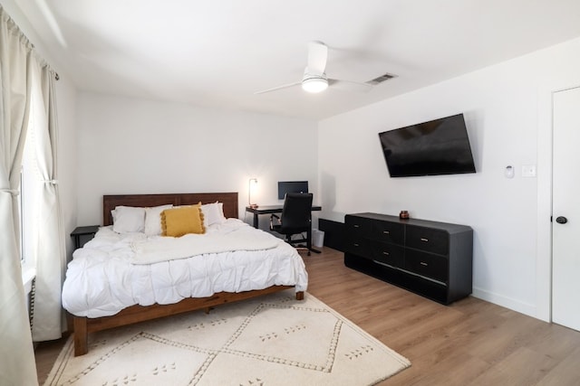 2205 Trede Dr, Austin, TX 78745 - bedroom featuring wood finished floors, ceiling fan, and baseboards