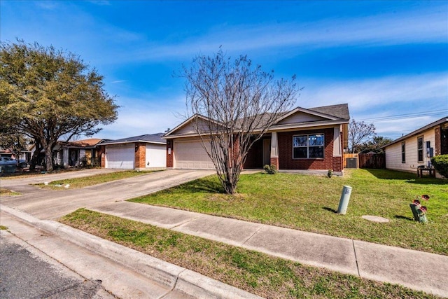 12900 Noche Clara Dr, Del Valle, TX 78617 - ranch-style home featuring brick siding, driveway, and an attached garage