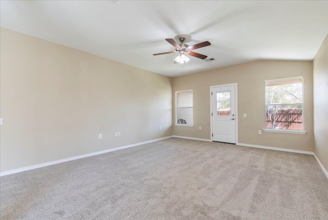 12900 Noche Clara Dr, Del Valle, TX 78617 - unfurnished room with a ceiling fan, light carpet, baseboards, and vaulted ceiling