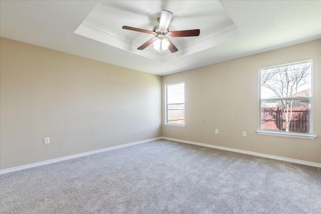 12900 Noche Clara Dr, Del Valle, TX 78617 - carpeted spare room with a raised ceiling, crown molding, baseboards, and a ceiling fan