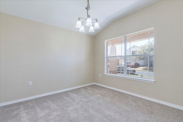 12900 Noche Clara Dr, Del Valle, TX 78617 - empty room with a chandelier, carpet floors, lofted ceiling, and baseboards