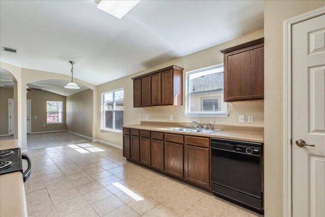 12900 Noche Clara Dr, Del Valle, TX 78617 - kitchen featuring black dishwasher, a sink, lofted ceiling, light tile patterned flooring, and light countertops