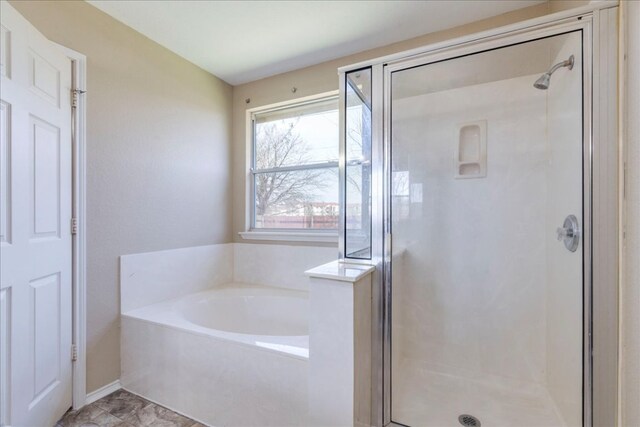 12900 Noche Clara Dr, Del Valle, TX 78617 - full bath with a shower stall and a bath