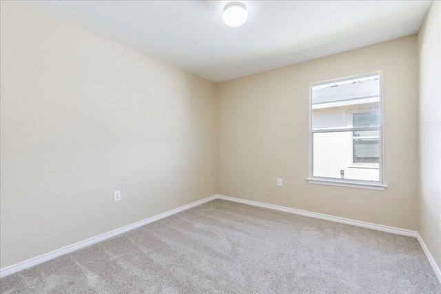 12900 Noche Clara Dr, Del Valle, TX 78617 - carpeted spare room featuring baseboards