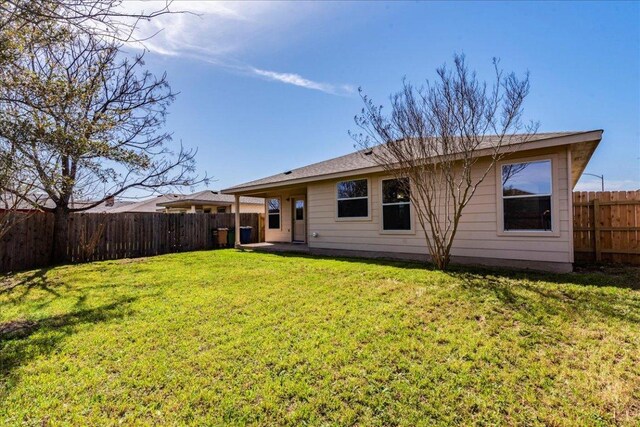 12900 Noche Clara Dr, Del Valle, TX 78617 - rear view of property featuring a patio area