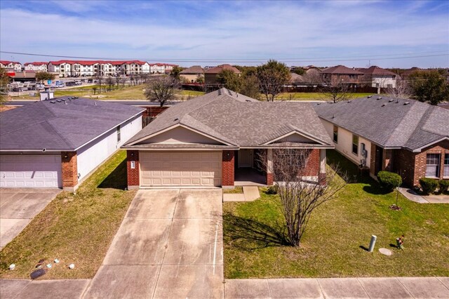 12900 Noche Clara Dr, Del Valle, TX 78617 - ranch-style house featuring brick siding, a garage, concrete driveway, a front yard, and a shingled roof