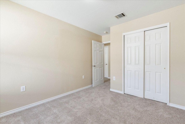 12900 Noche Clara Dr, Del Valle, TX 78617 - unfurnished bedroom with carpet, baseboards, and a closet