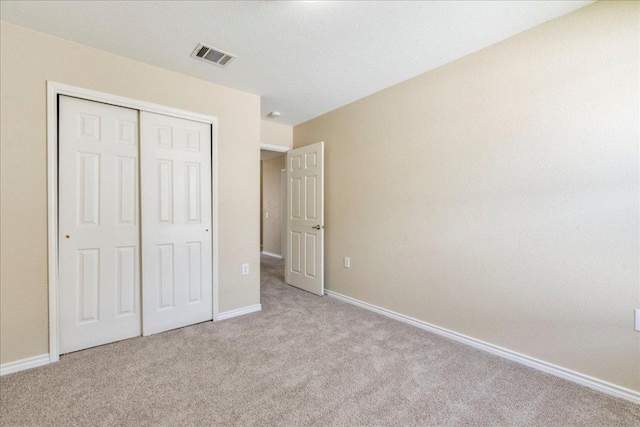 12900 Noche Clara Dr, Del Valle, TX 78617 - unfurnished bedroom featuring carpet flooring, baseboards, and a closet