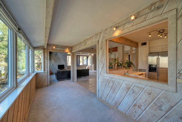 614 Sunfish St, Lakeway, TX 78734 - unfurnished sunroom with plenty of natural light, carpet floors, and beam ceiling
