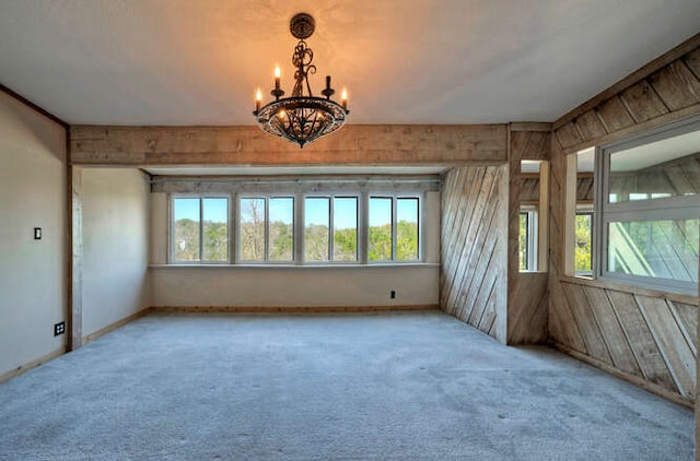 614 Sunfish St, Lakeway, TX 78734 - spare room featuring a chandelier, carpet, and baseboards