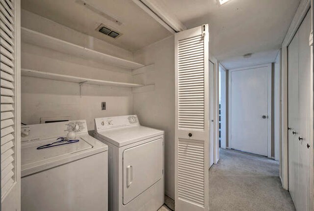 614 Sunfish St, Lakeway, TX 78734 - washroom with washing machine and dryer and light colored carpet