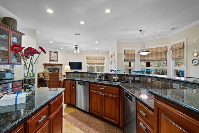 4403 Elohi Dr, Austin, TX 78746 - kitchen with stainless steel dishwasher, a fireplace, ceiling fan, ornamental molding, and recessed lighting
