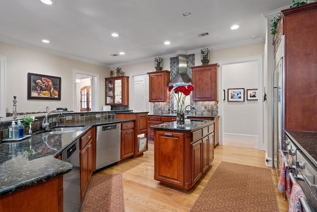 4403 Elohi Dr, Austin, TX 78746 - kitchen with dishwasher, wall chimney range hood, an island with sink, recessed lighting, and tasteful backsplash
