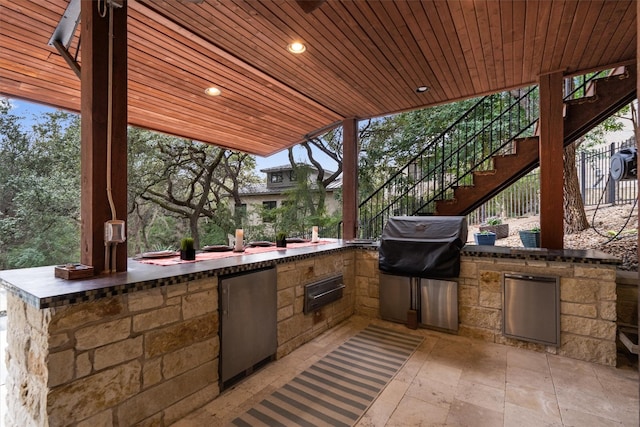 4403 Elohi Dr, Austin, TX 78746 - view of patio / terrace with stairway and an outdoor kitchen