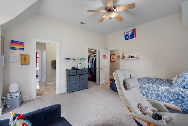4403 Elohi Dr, Austin, TX 78746 - bedroom with a walk in closet, light colored carpet, a closet, ceiling fan, and lofted ceiling