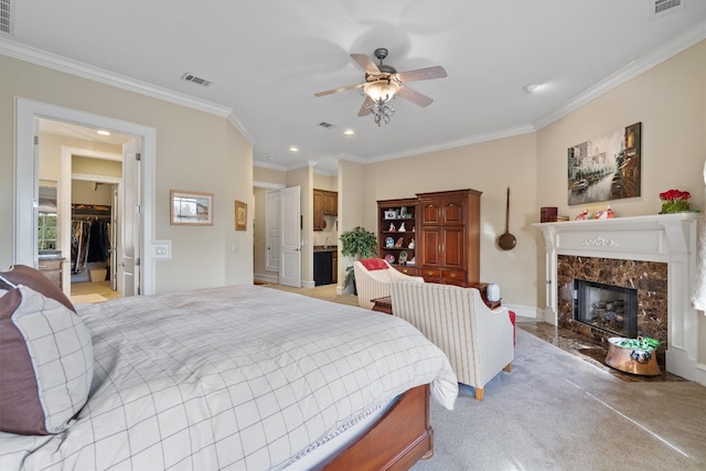 4403 Elohi Dr, Austin, TX 78746 - bedroom featuring crown molding, a premium fireplace, recessed lighting, a walk in closet, and a closet