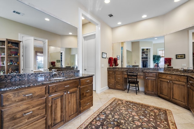 4403 Elohi Dr, Austin, TX 78746 - full bath with vanity, tile patterned floors, recessed lighting, and a walk in closet