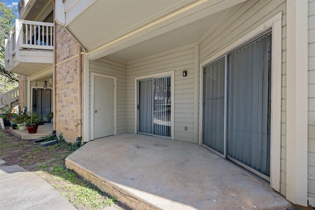 2450 Wickersham Ln Unit 101, Austin, TX 78741 - view of patio with a balcony