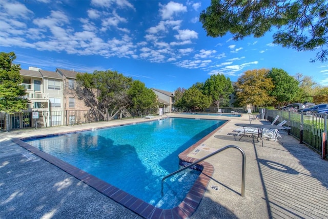 2450 Wickersham Ln Unit 101, Austin, TX 78741 - pool featuring a patio and fence