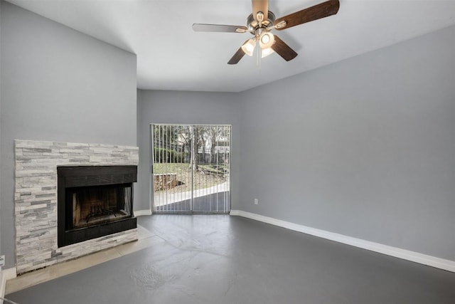 2450 Wickersham Ln Unit 101, Austin, TX 78741 - unfurnished living room with finished concrete floors, a fireplace, a ceiling fan, and baseboards