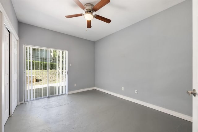 2450 Wickersham Ln Unit 101, Austin, TX 78741 - unfurnished room featuring baseboards, finished concrete flooring, and a ceiling fan